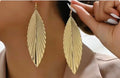 Pair Golden Leaf Dangle Earrings, Textured Long vintage Style, Elegant Fashion.
